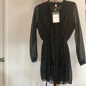 White polka dotted black dress